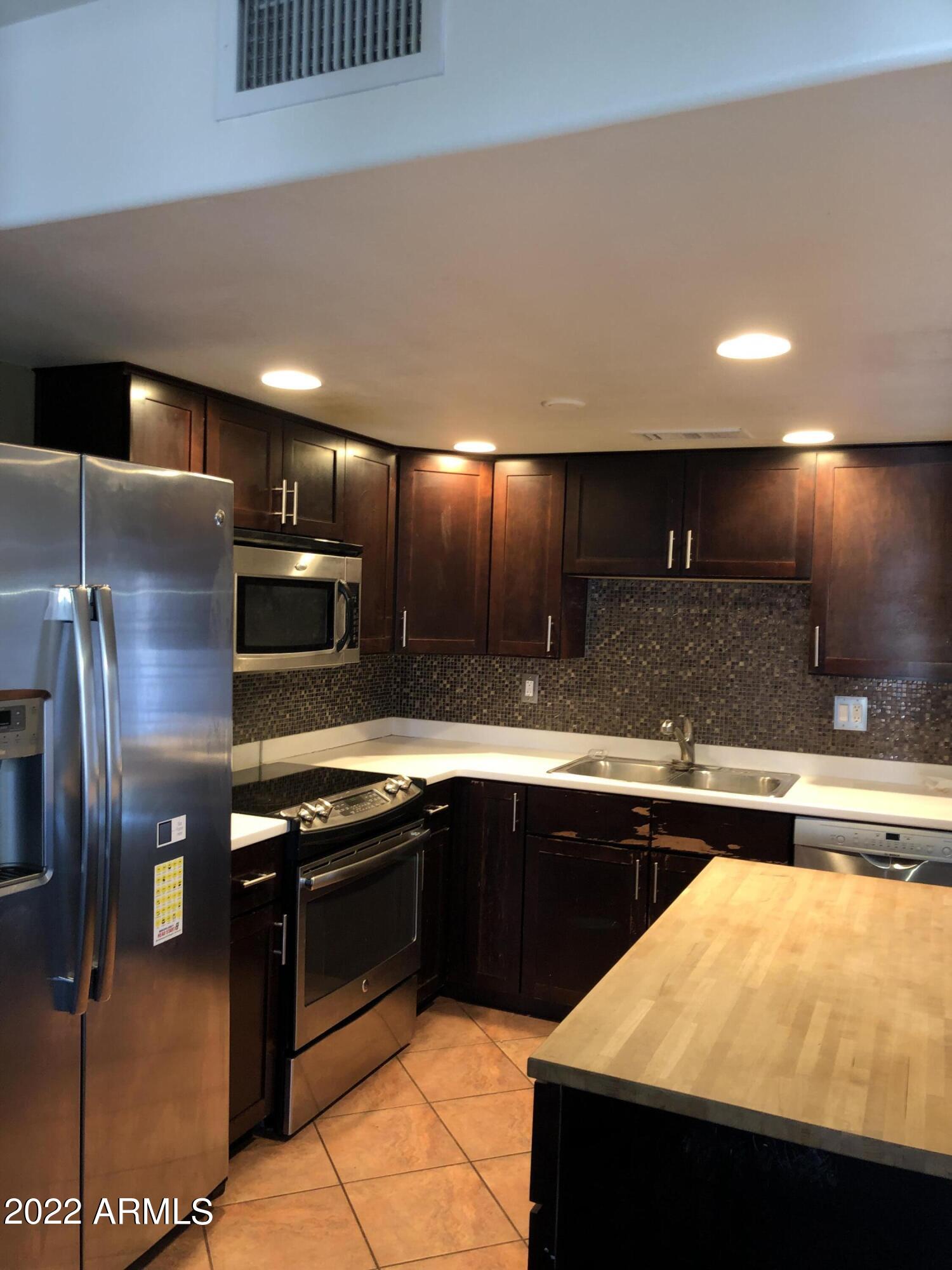 8211 E GARFIELD Street Unit: J13