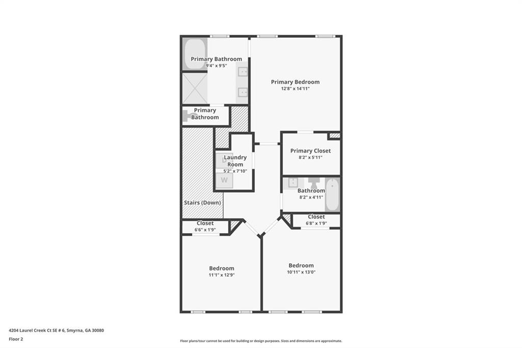 Second-floor plan with a primary bedroom, two bedrooms, two bathrooms, laundry room, closets, and stairs down.