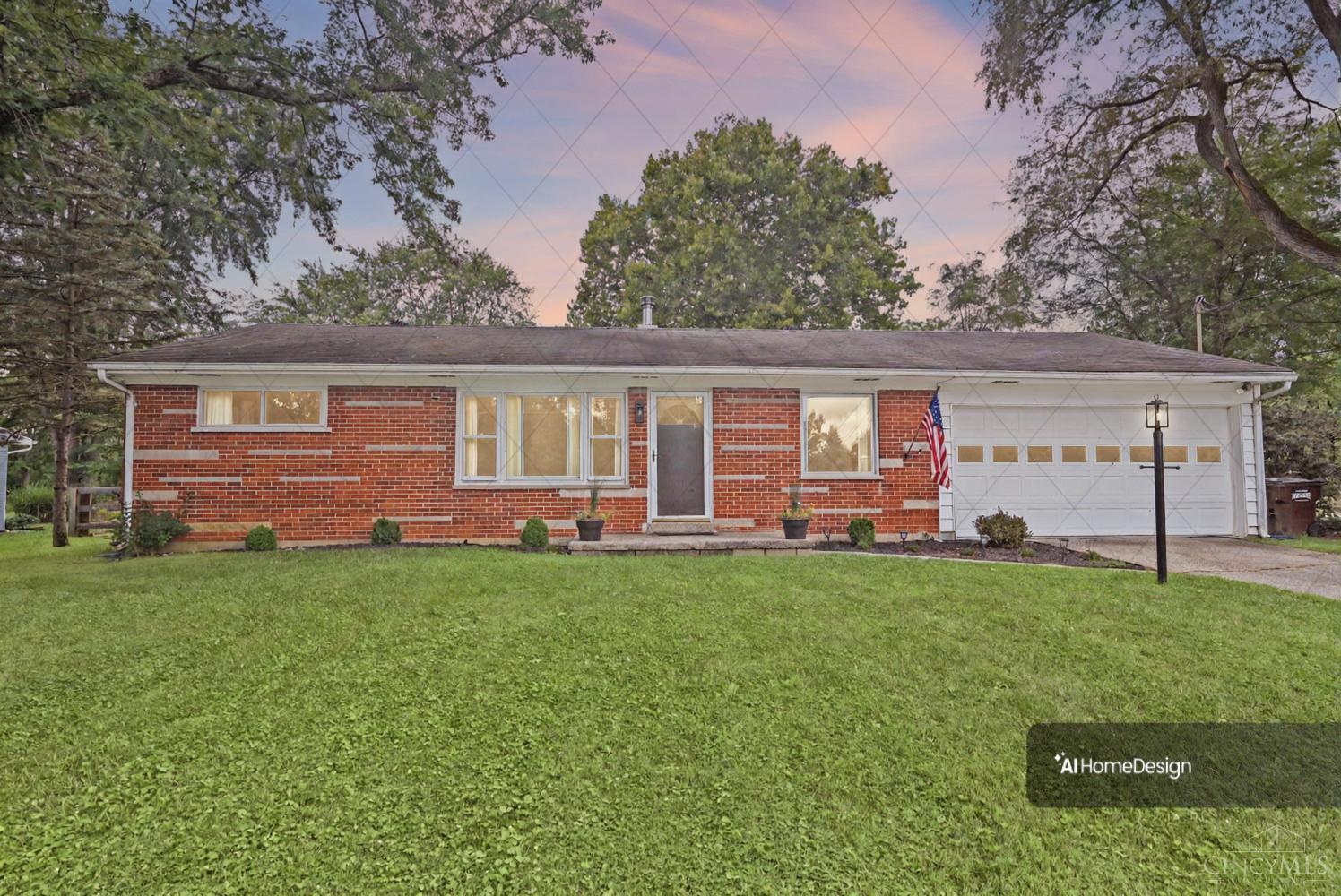 Single-story red brick house with an attached white garage, green lawn, and American flag at dusk.