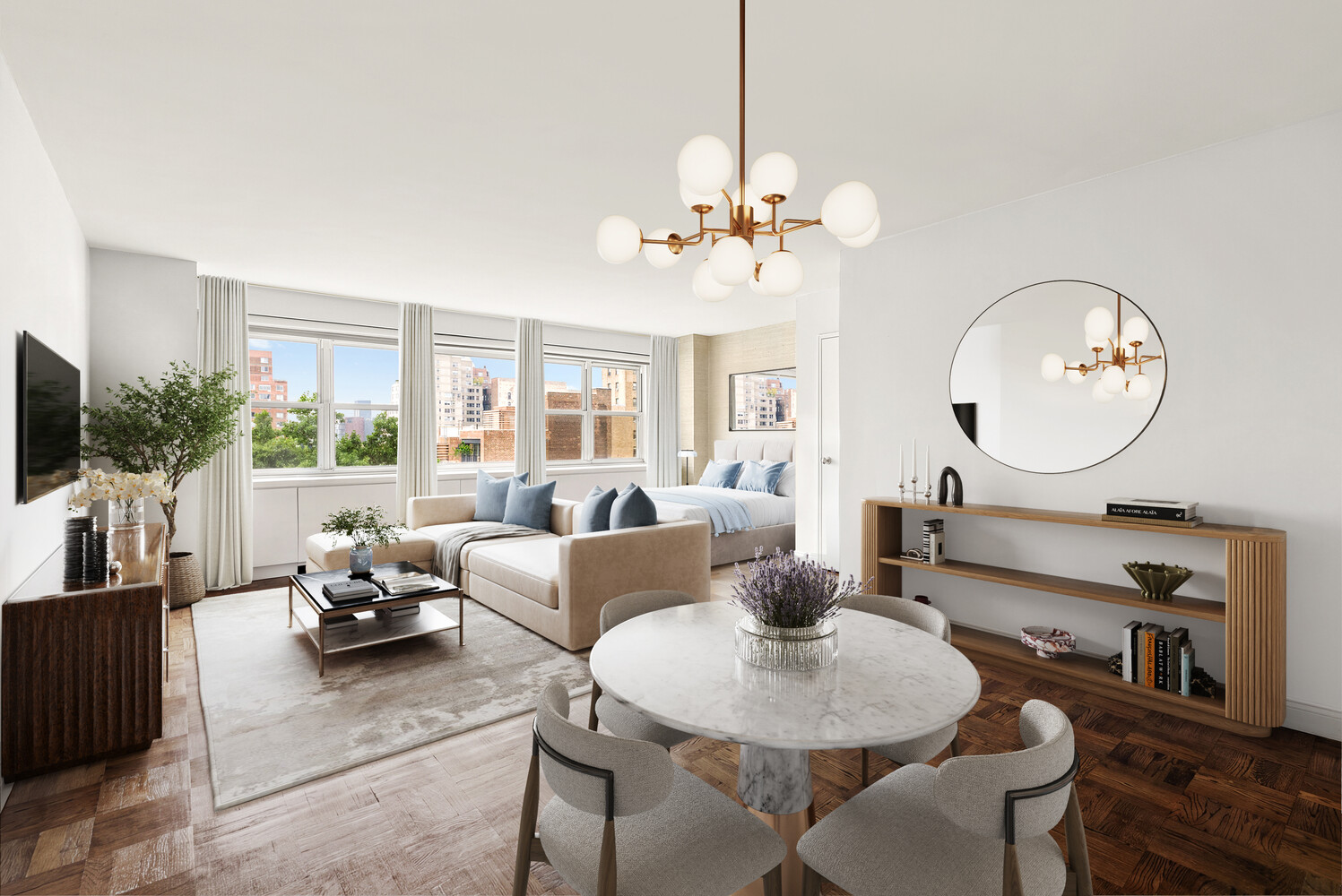 Bright open-plan living and dining area with a bed, large windows, and city views.