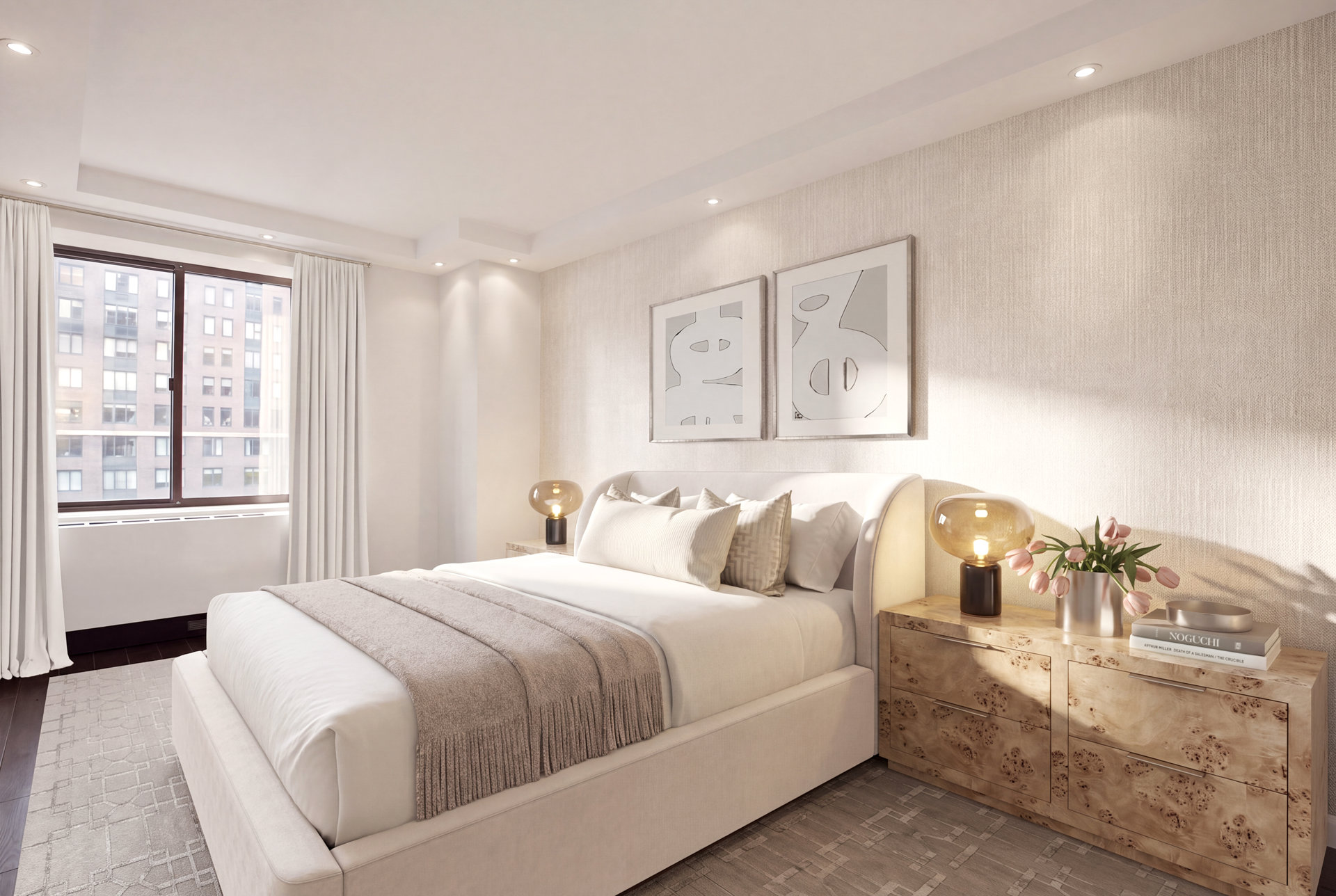 Furnished bedroom with a white upholstered bed, neutral bedding, framed artwork, and windows overlooking neighboring buildings.