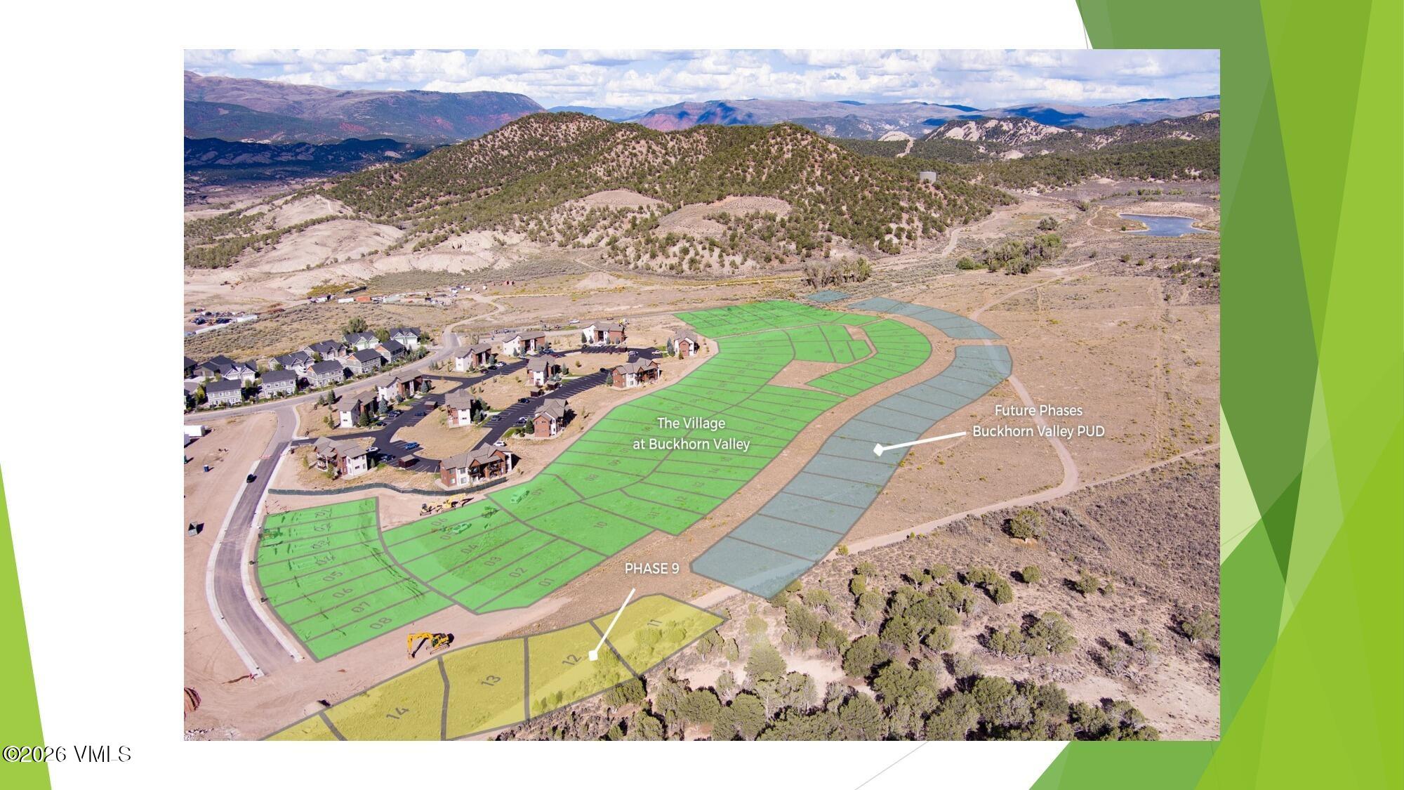 Aerial view of Buckhorn Valley subdivision lots and homes, with mountain ridges in the distance.