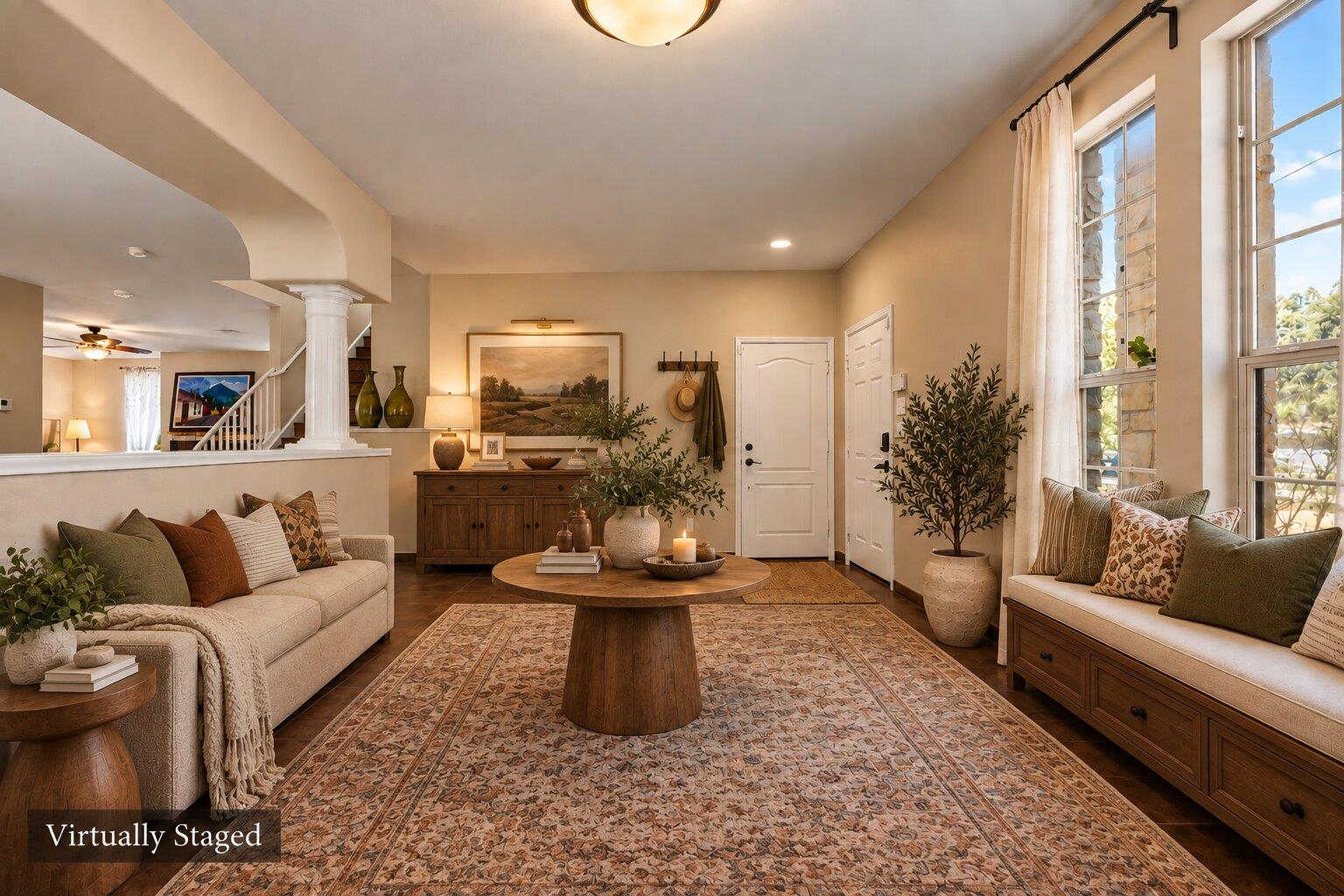Virtually staged living room with two sofas, a round coffee table, patterned rug, and tall windows.