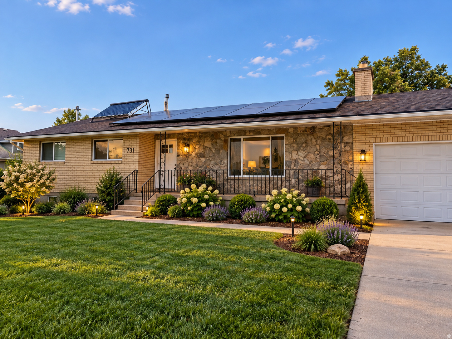 Brick and stone home with rooftop solar panels, landscaped front yard, and attached garage.