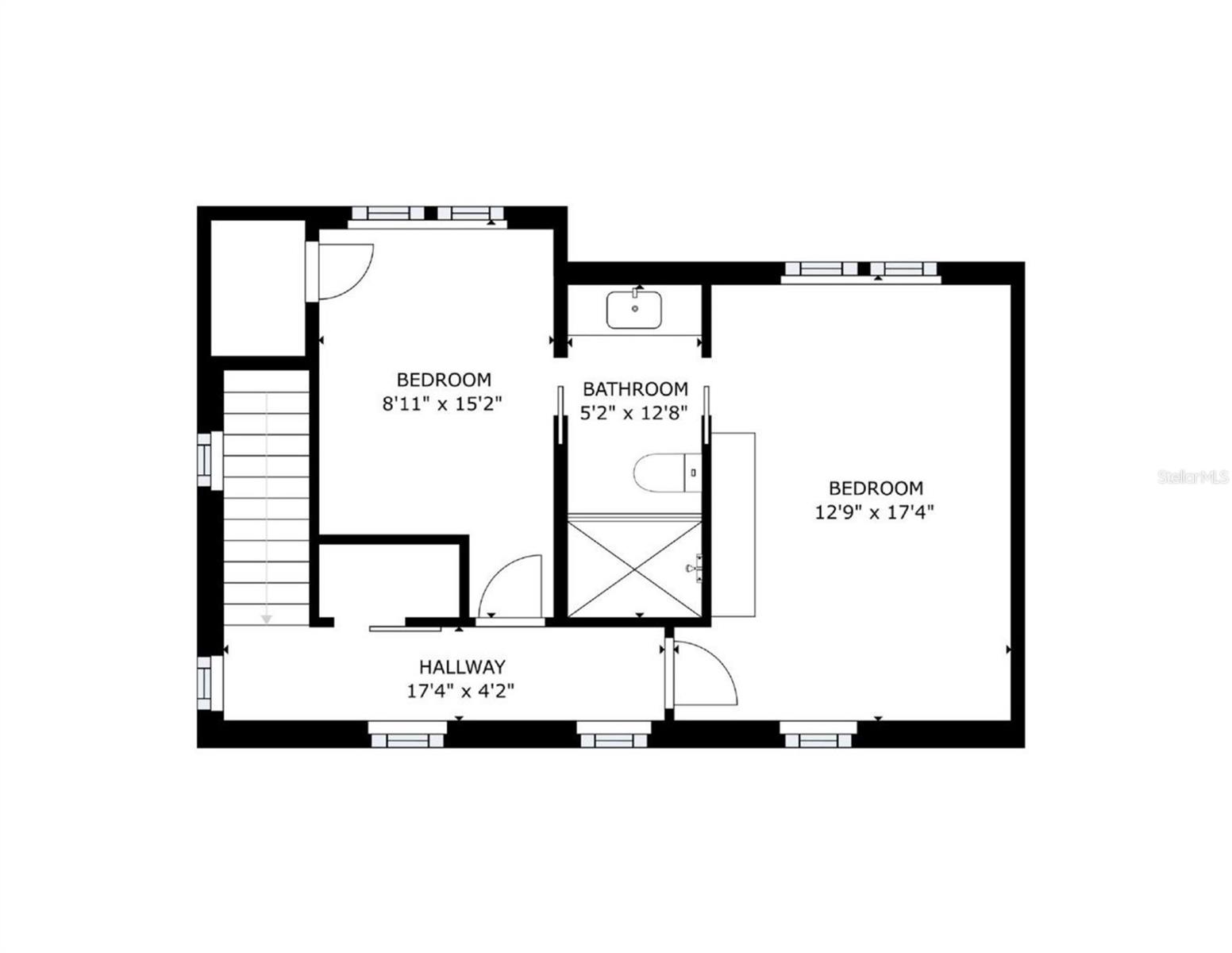 Upper-level floor plan with two bedrooms, a bathroom, hallway, and staircase.