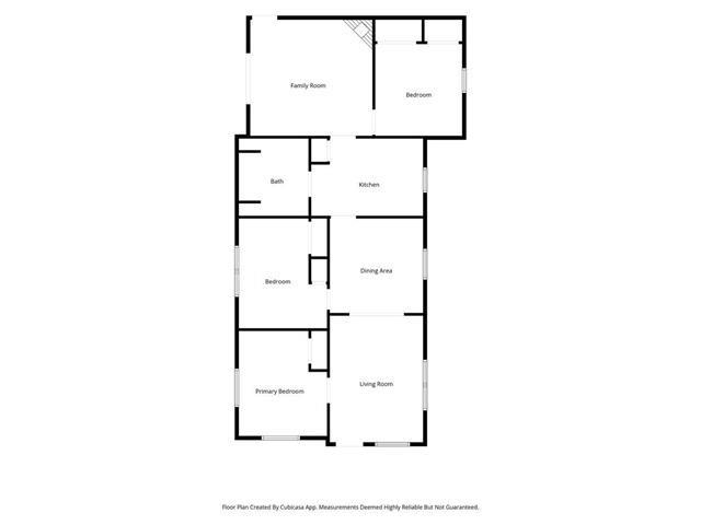 Floor plan showing a family room, two bedrooms, bath, kitchen, dining area, and living room.