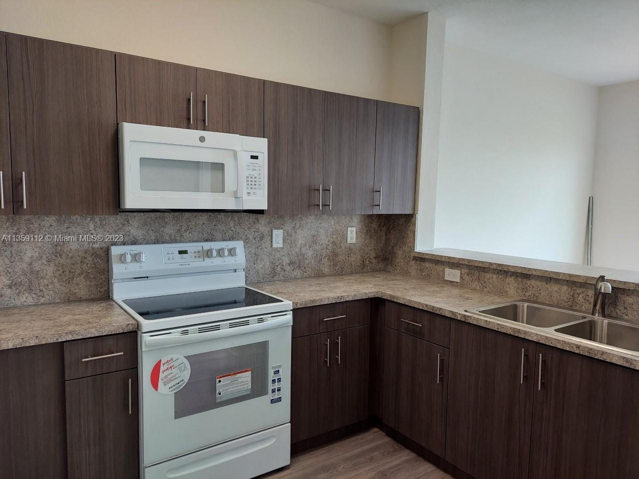 17820 NW 73rd Ave Unit: 201-1