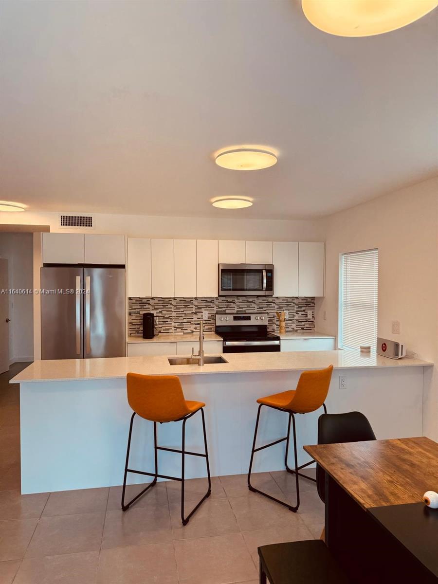 737 NW 4th St