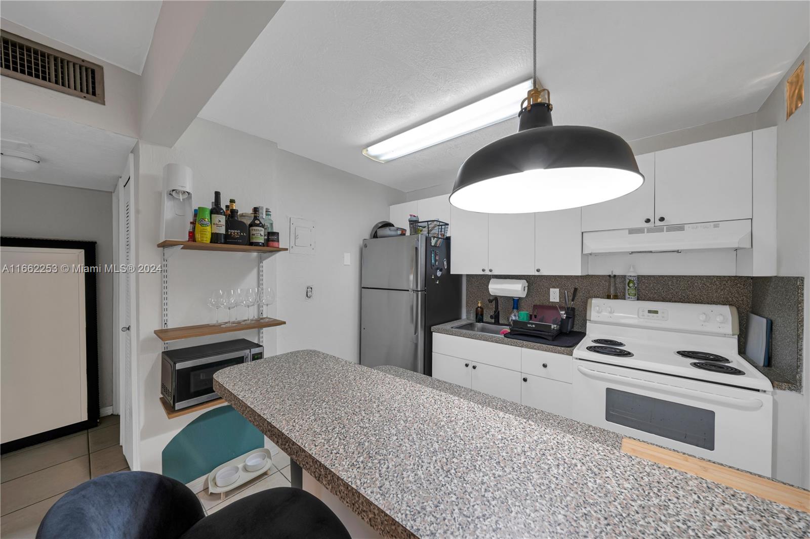 4275 NW South Tamiami Canal Dr # 103 Unit: 2-103
