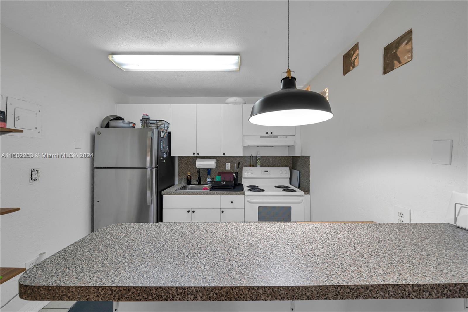 4275 NW South Tamiami Canal Dr # 103 Unit: 2-103
