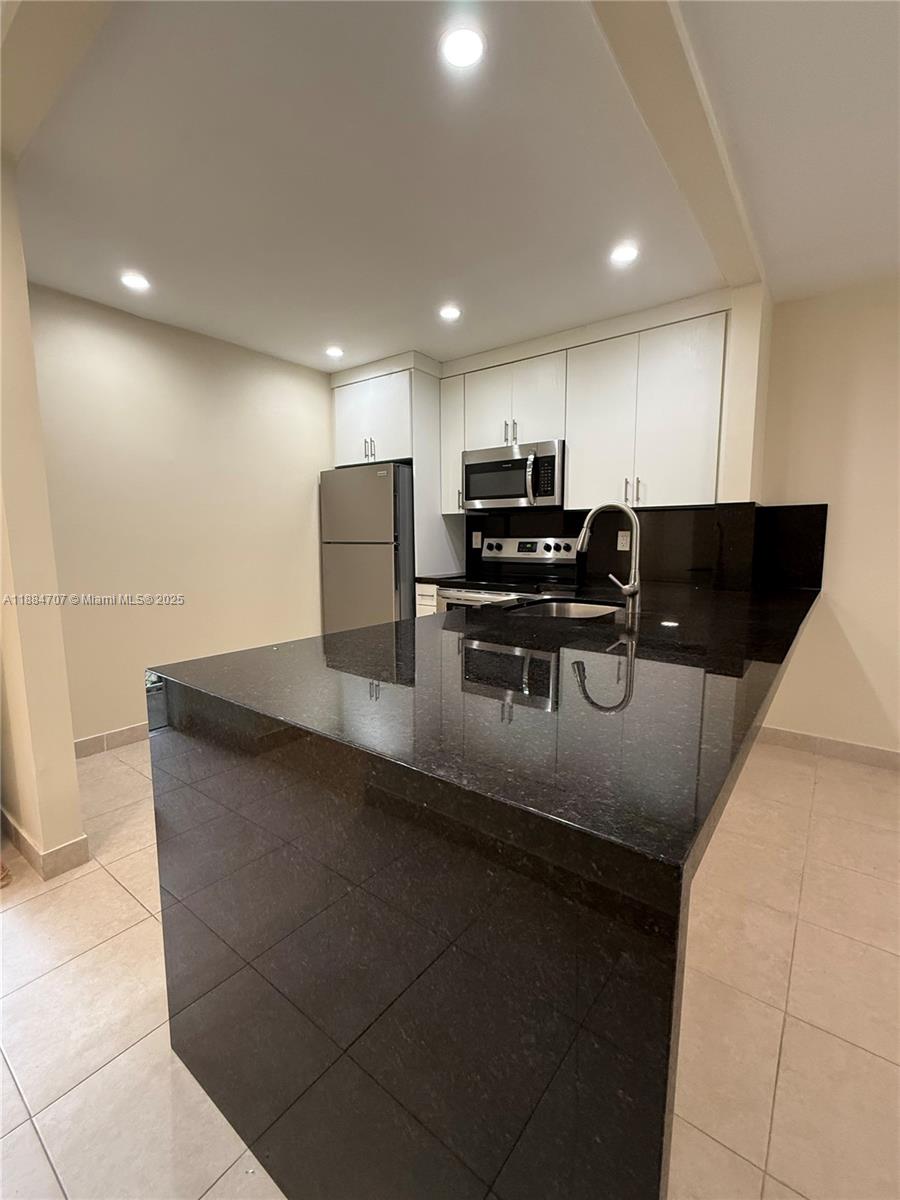 8101 Camino Real # C220