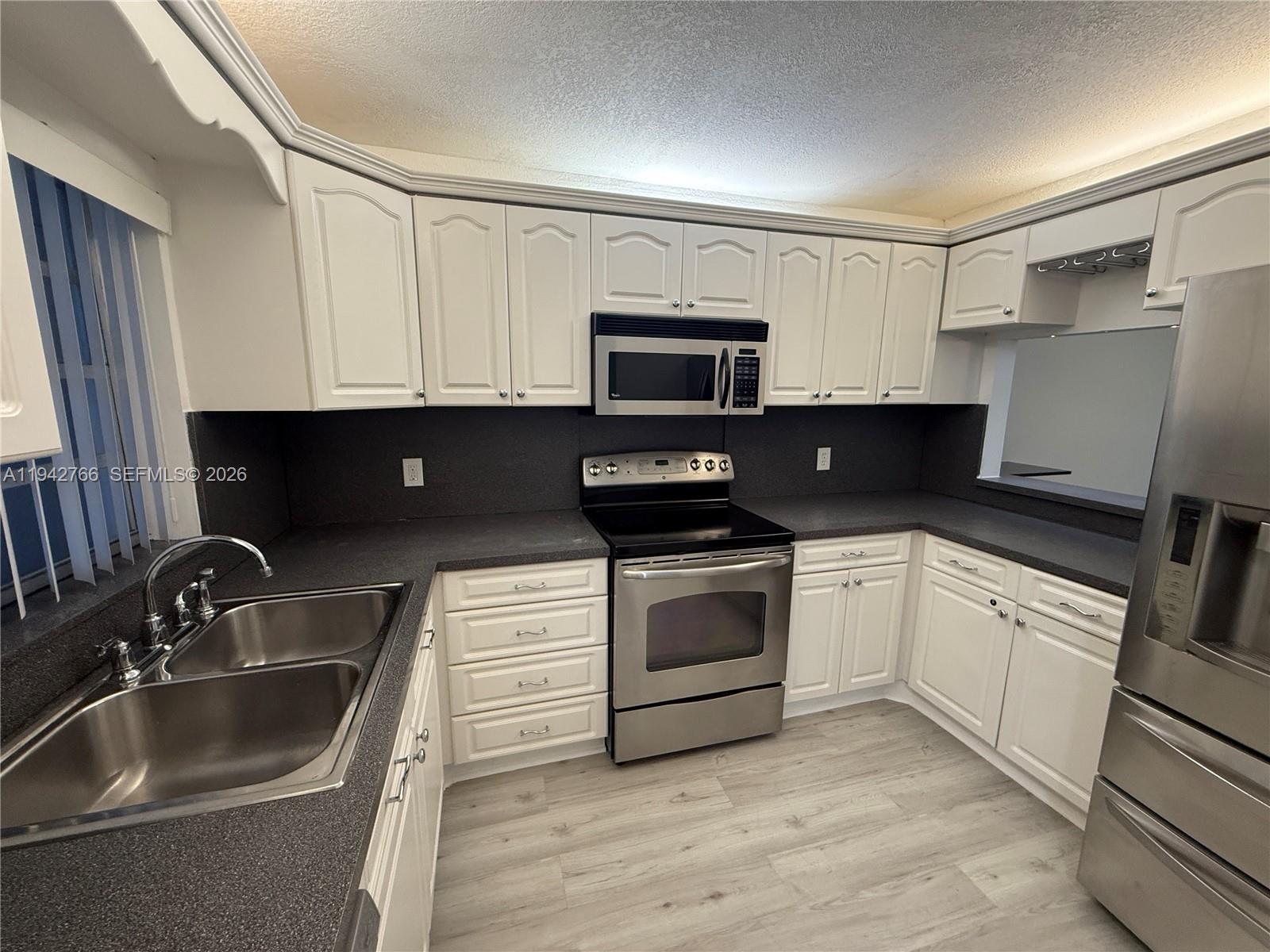 9470 Live Oak Pl # 104