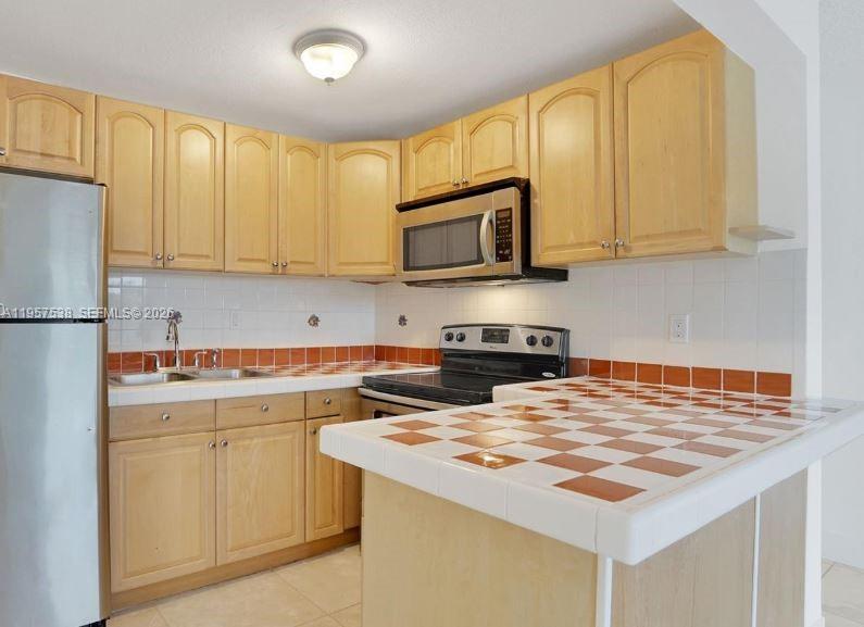 4275 NW South Tamiami Canal Dr # 310 Unit: 2-310