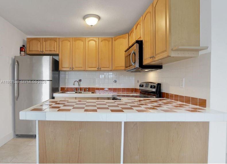 4275 NW South Tamiami Canal Dr # 310 Unit: 2-310