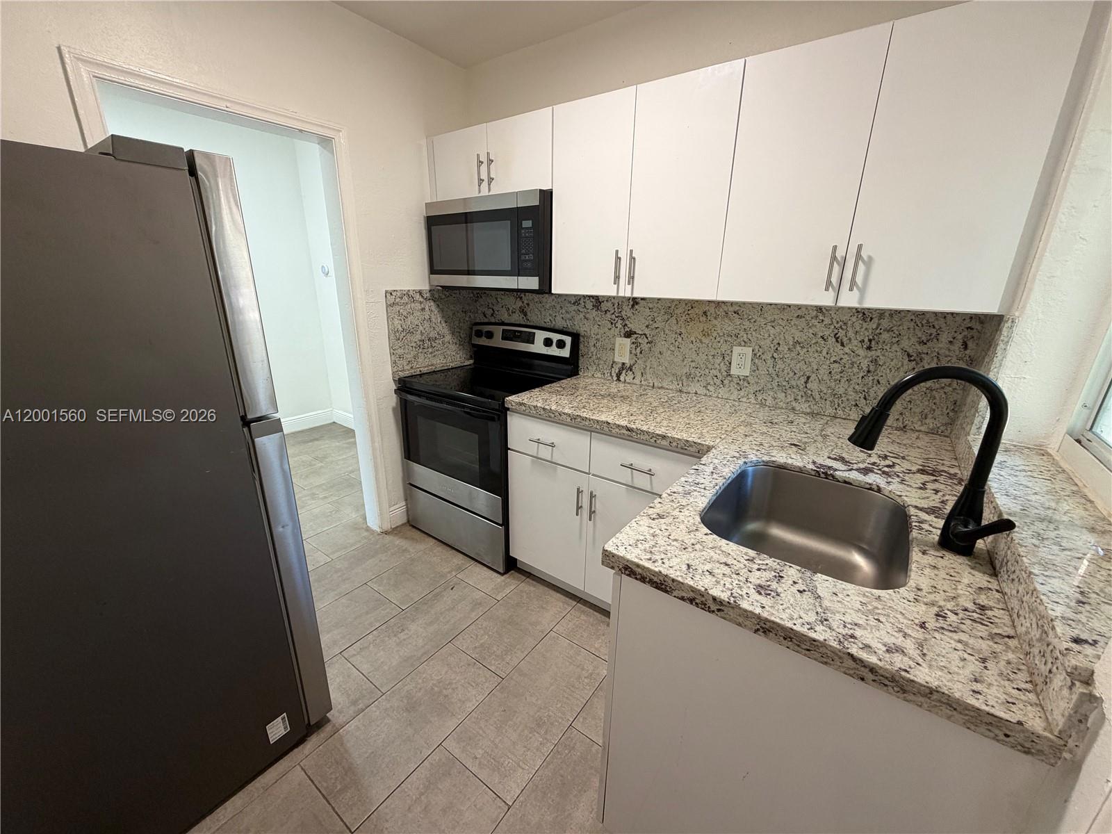 7712 NE 1st Ct Unit: -