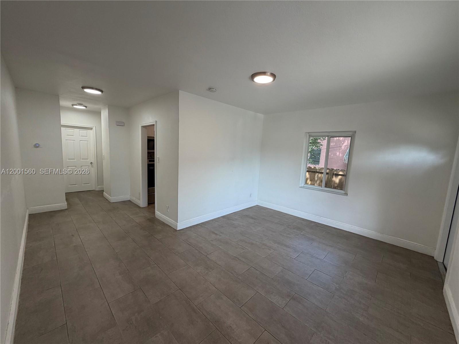 7712 NE 1st Ct Unit: -