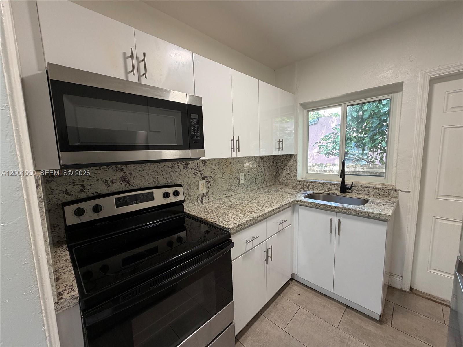7712 NE 1st Ct Unit: -