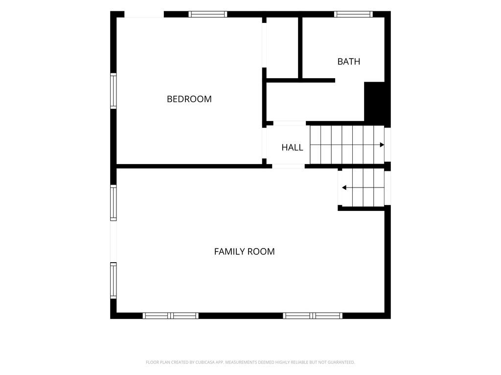 Floor plan with a bedroom, bath, hall, family room, and staircase.
