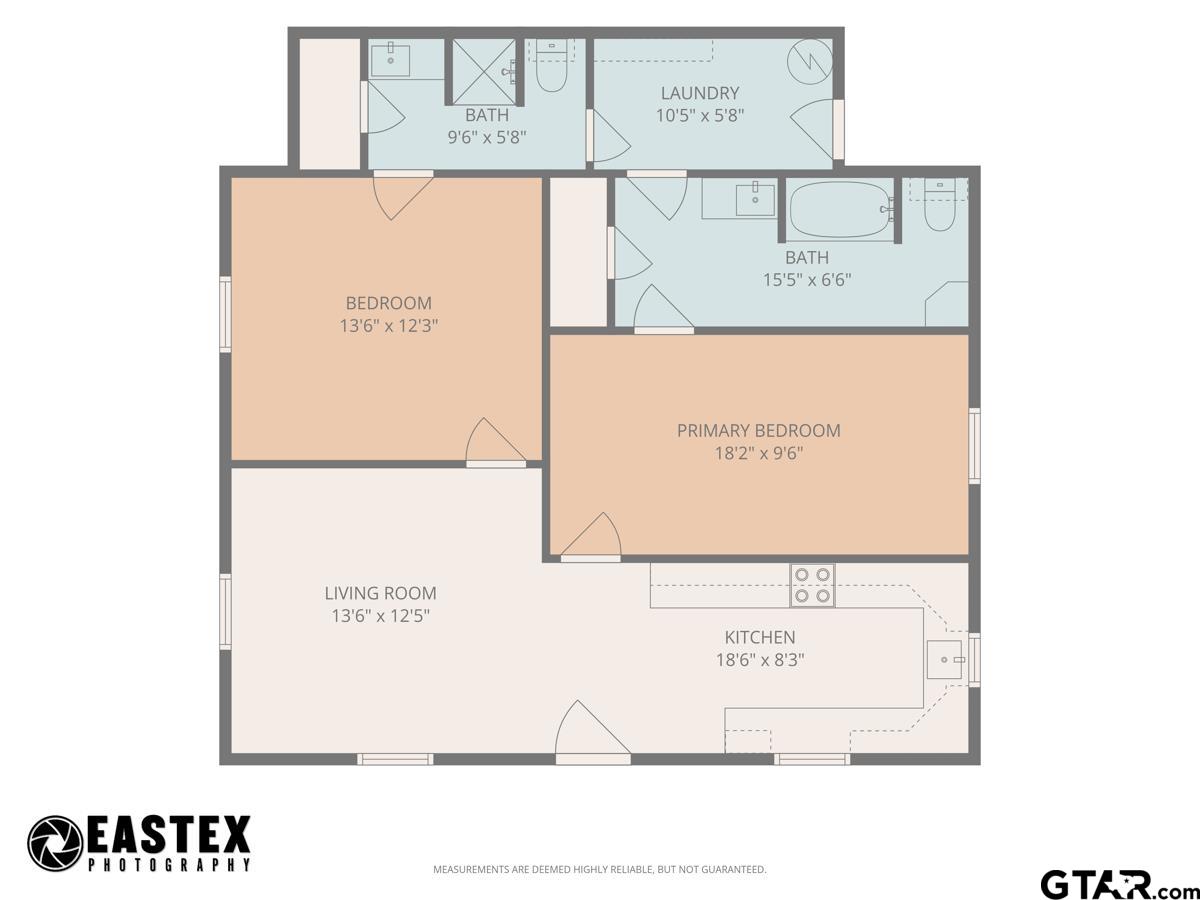 Floor plan showing two bedrooms, two bathrooms, a living room, kitchen, and laundry room.