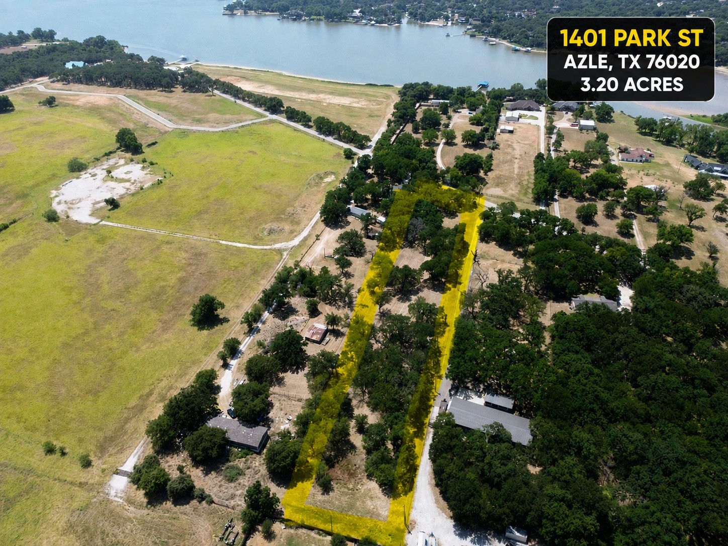 Aerial view of a 3.20-acre wooded parcel in Azle, outlined in yellow near a lake.