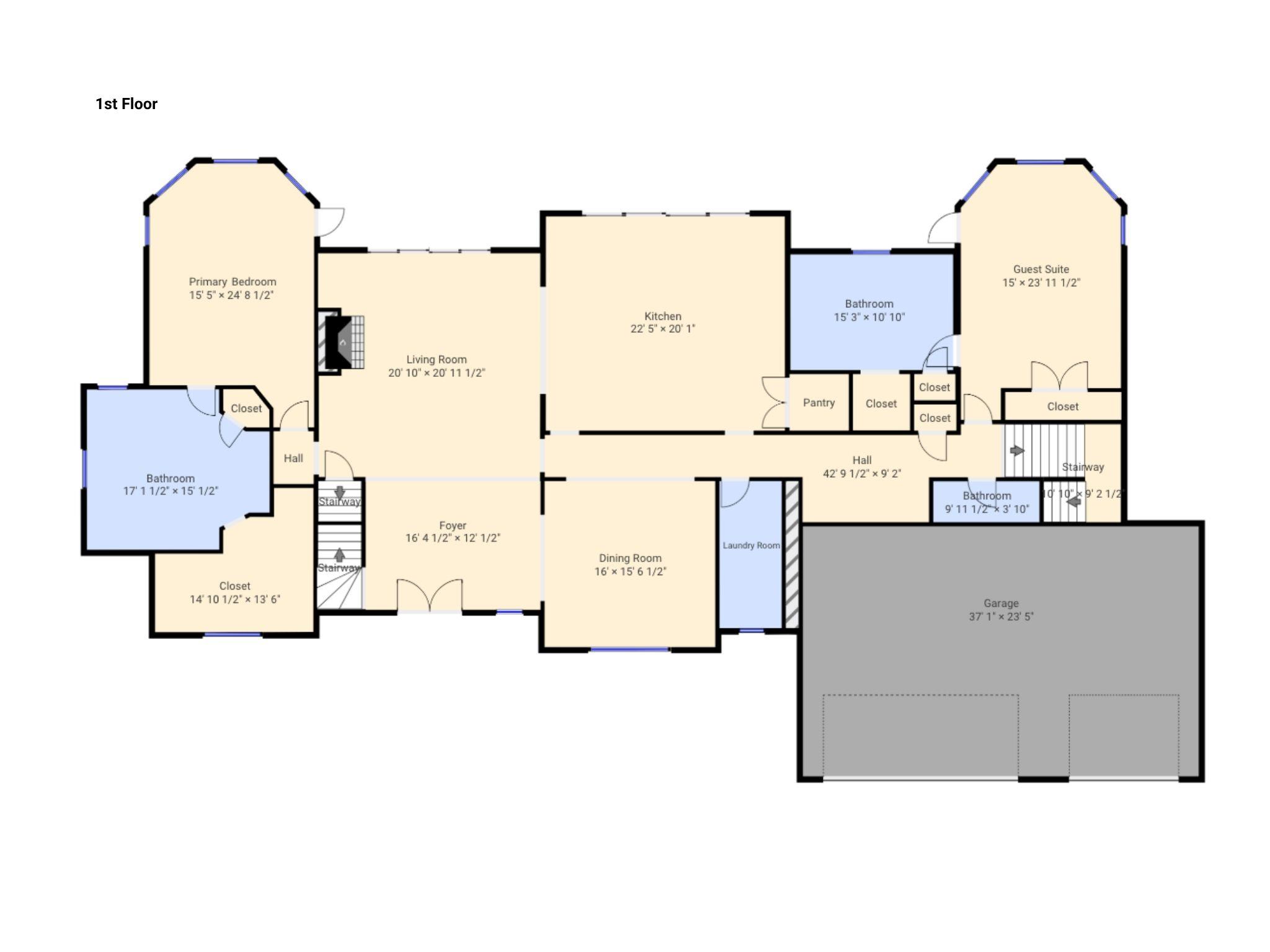 First-floor plan showing a primary bedroom, guest suite, central living spaces, and an attached two-car garage.