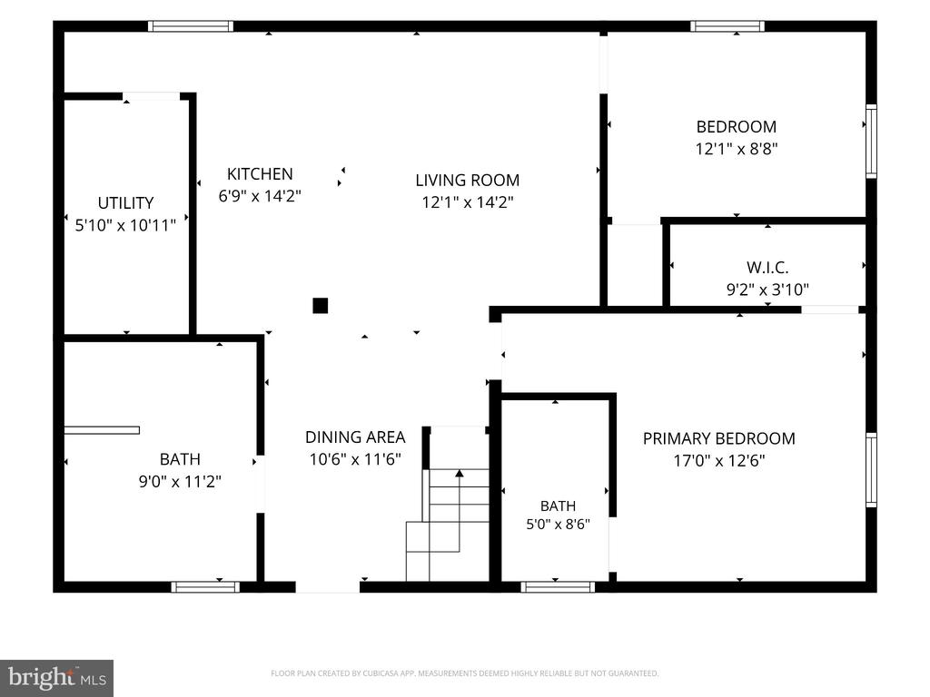 Floor plan with labeled rooms and dimensions, including a primary bedroom, two bathrooms, and staircase.