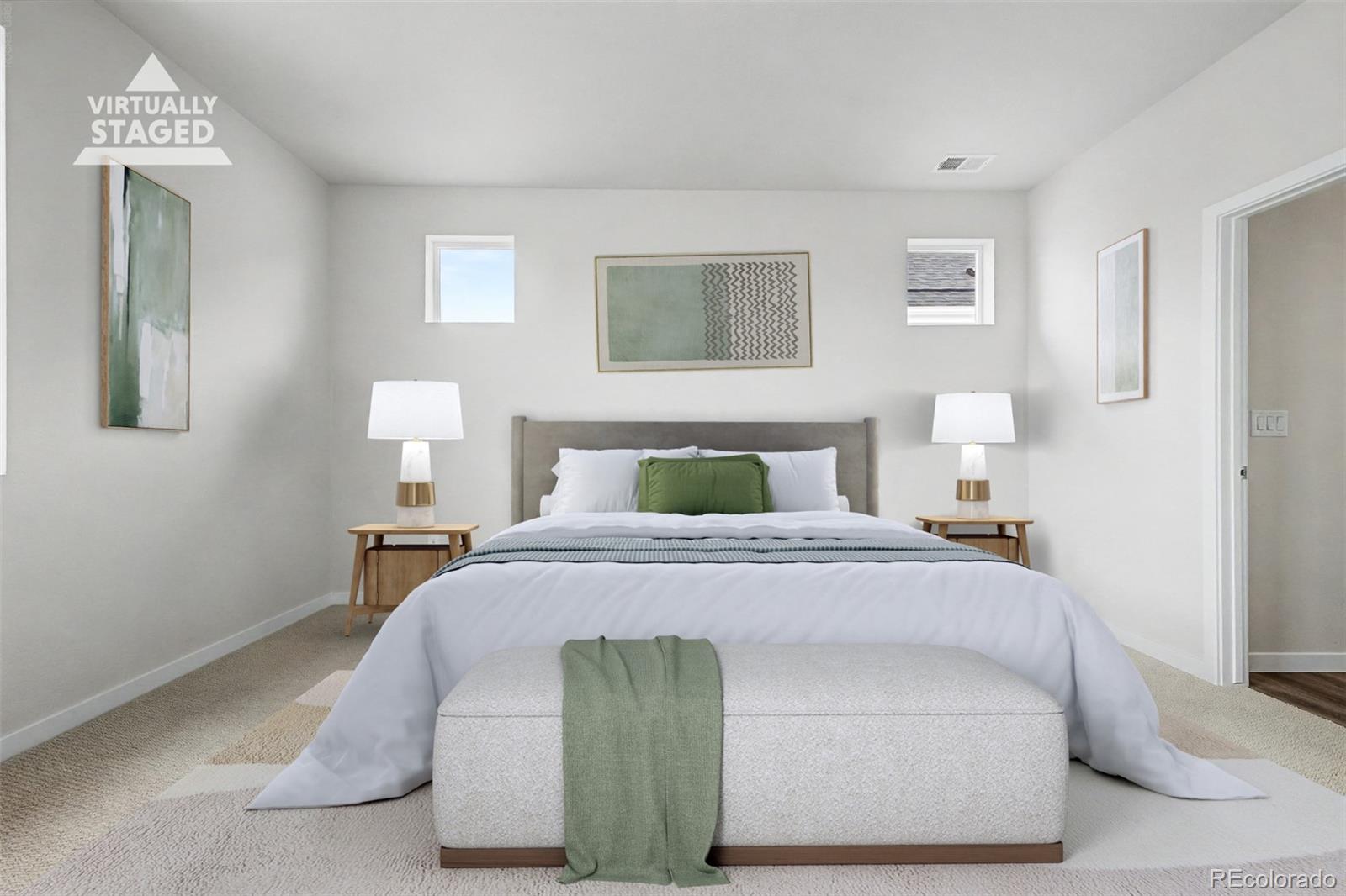 Virtually staged bedroom with a centered bed, green accents, matching bedside lamps, and neutral carpet.