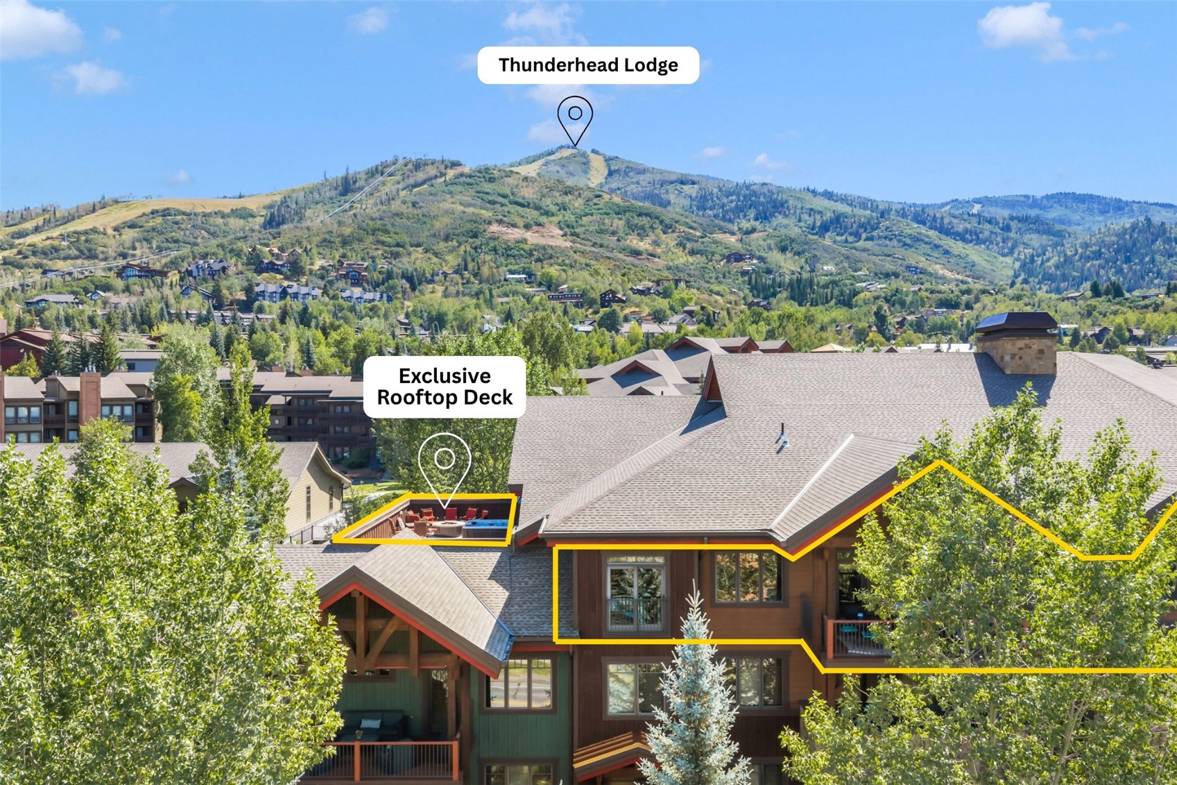 Mountain condominium with an exclusive rooftop deck and forested mountain views.