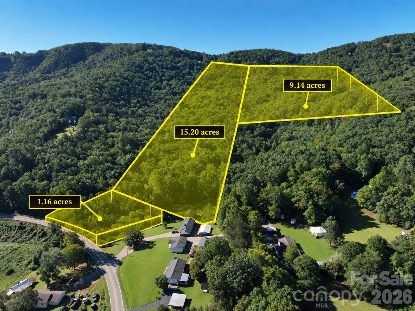 Aerial view of wooded land parcels outlined in yellow, labeled with acreage.