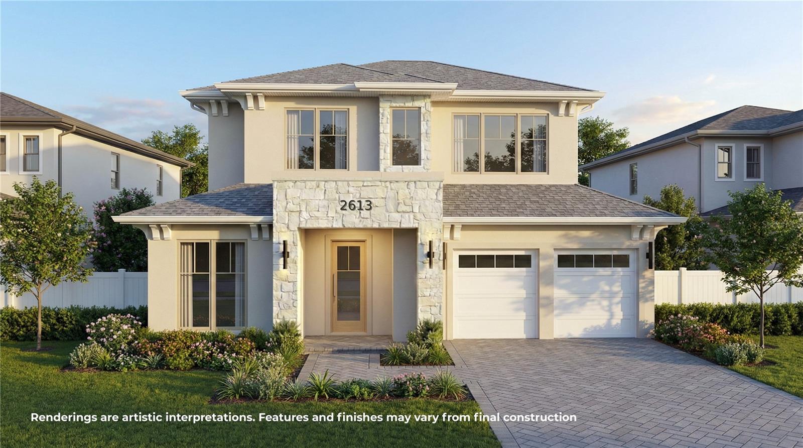 Two-story home with a stone-accented facade, two-car garage, and landscaped front yard.