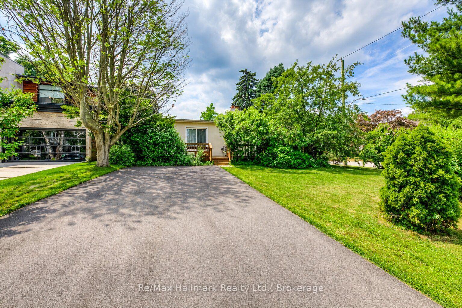 Home at 1510 Constance Drive with a broad driveway and leafy landscaped yard.