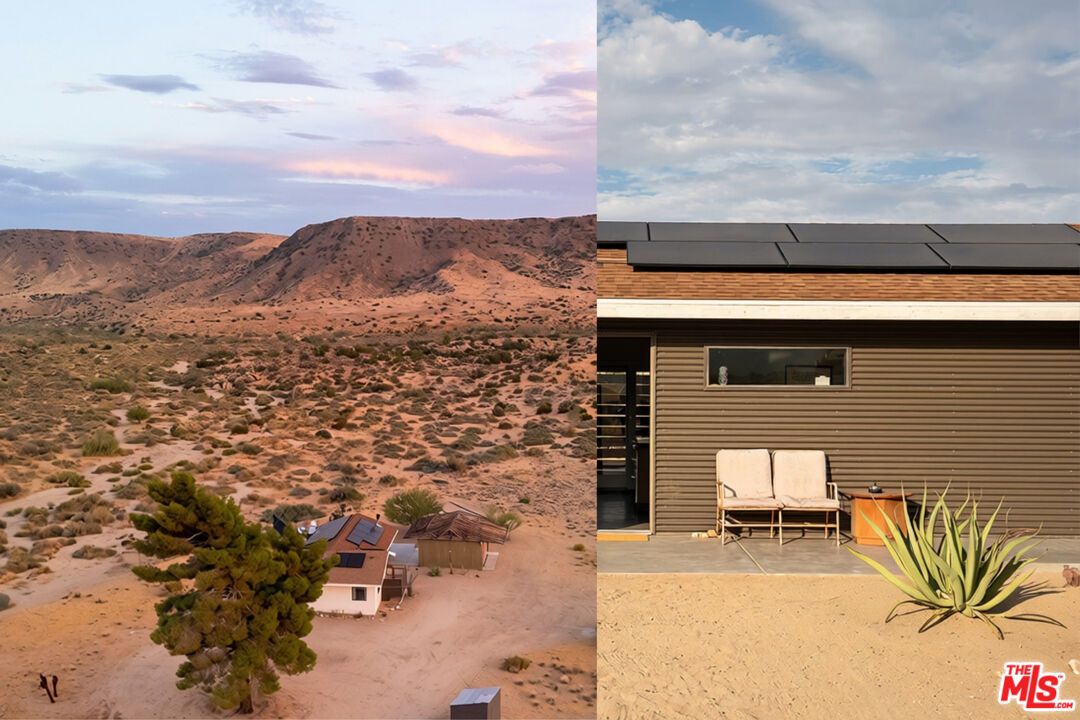 Desert home with rooftop solar panels and patio seating, surrounded by rugged hills.
