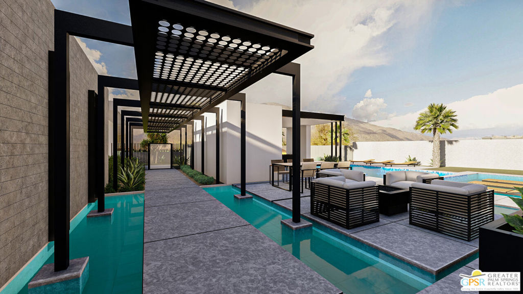 Modern courtyard with a reflecting pool, black pergola, outdoor lounge seating, palm tree, and distant mountains.
