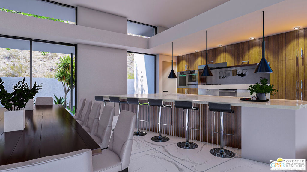 Modern kitchen with a marble island, warm wood cabinetry, and an adjoining dining table beside large windows.