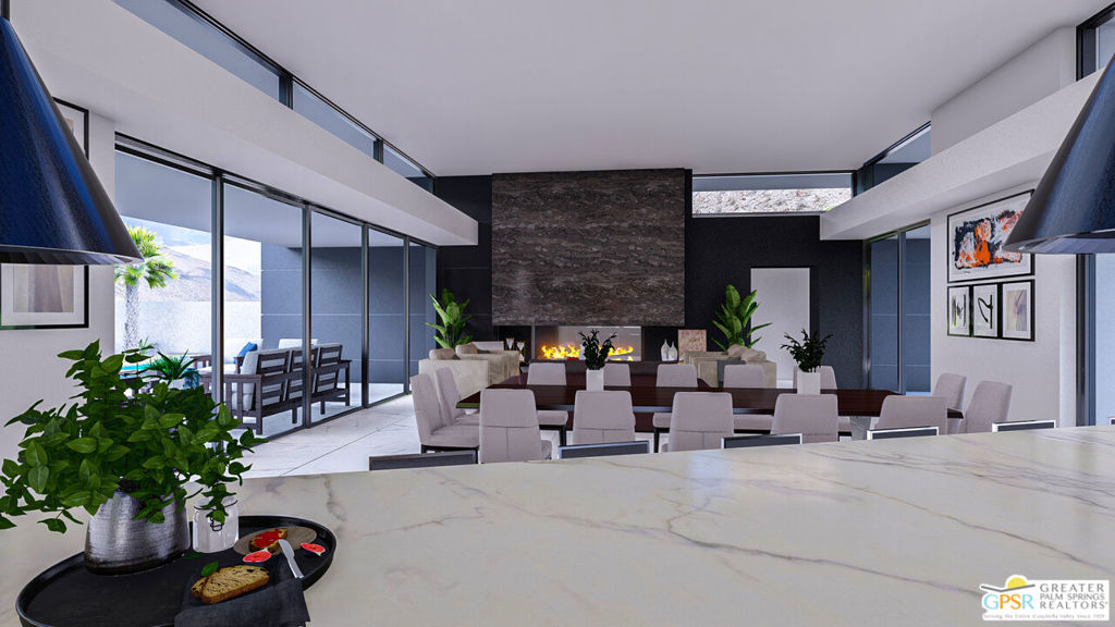 Open-plan living and dining room with a stone fireplace, marble island, and floor-to-ceiling glass walls.