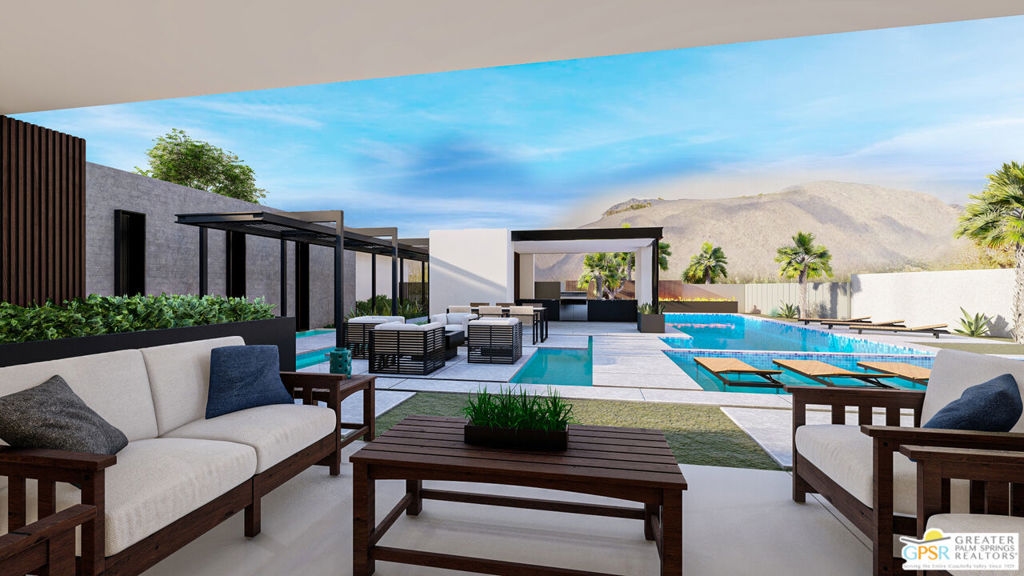 Modern outdoor patio with lounge seating, a swimming pool, and mountain views.