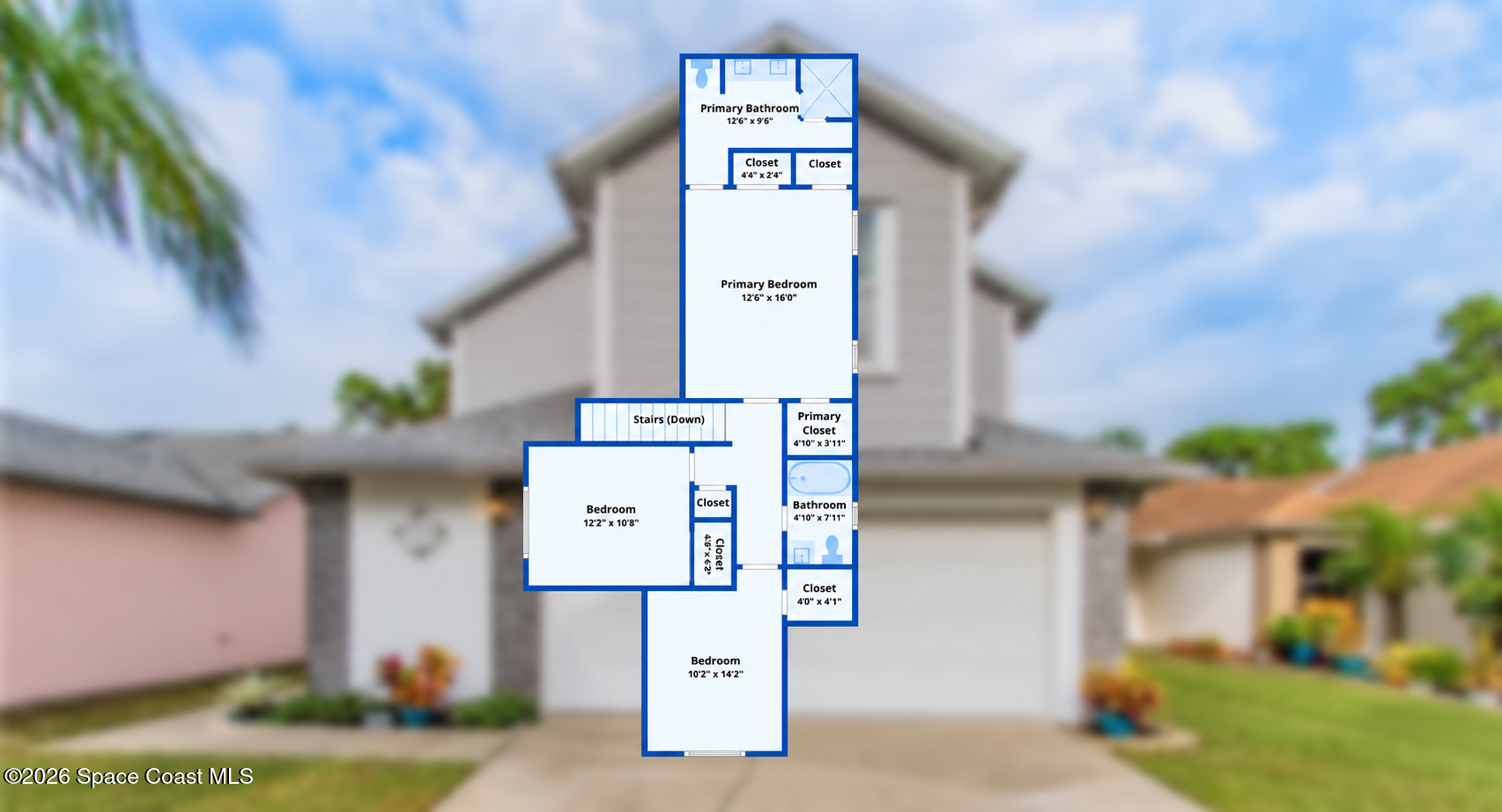 Second-floor floor plan showing a primary suite, two additional bedrooms, bathrooms, closets, and stairs.