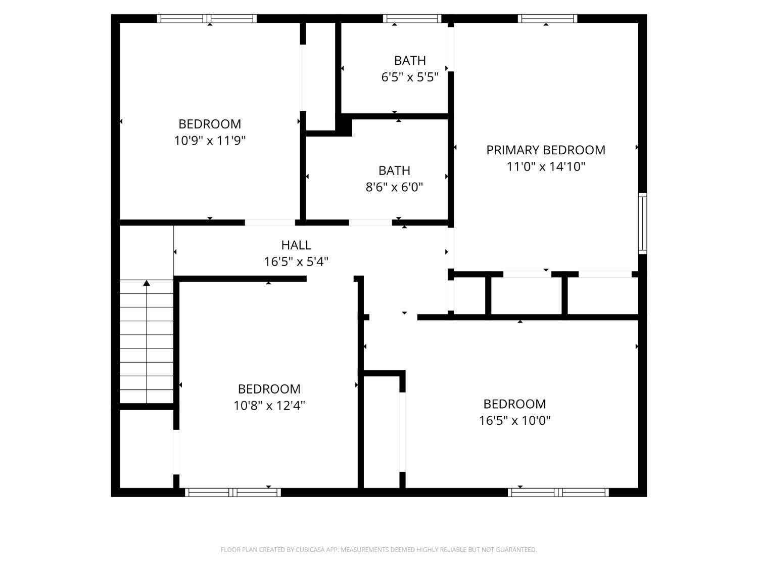 Second-floor plan showing three bedrooms, two bathrooms, a hall, and a staircase.