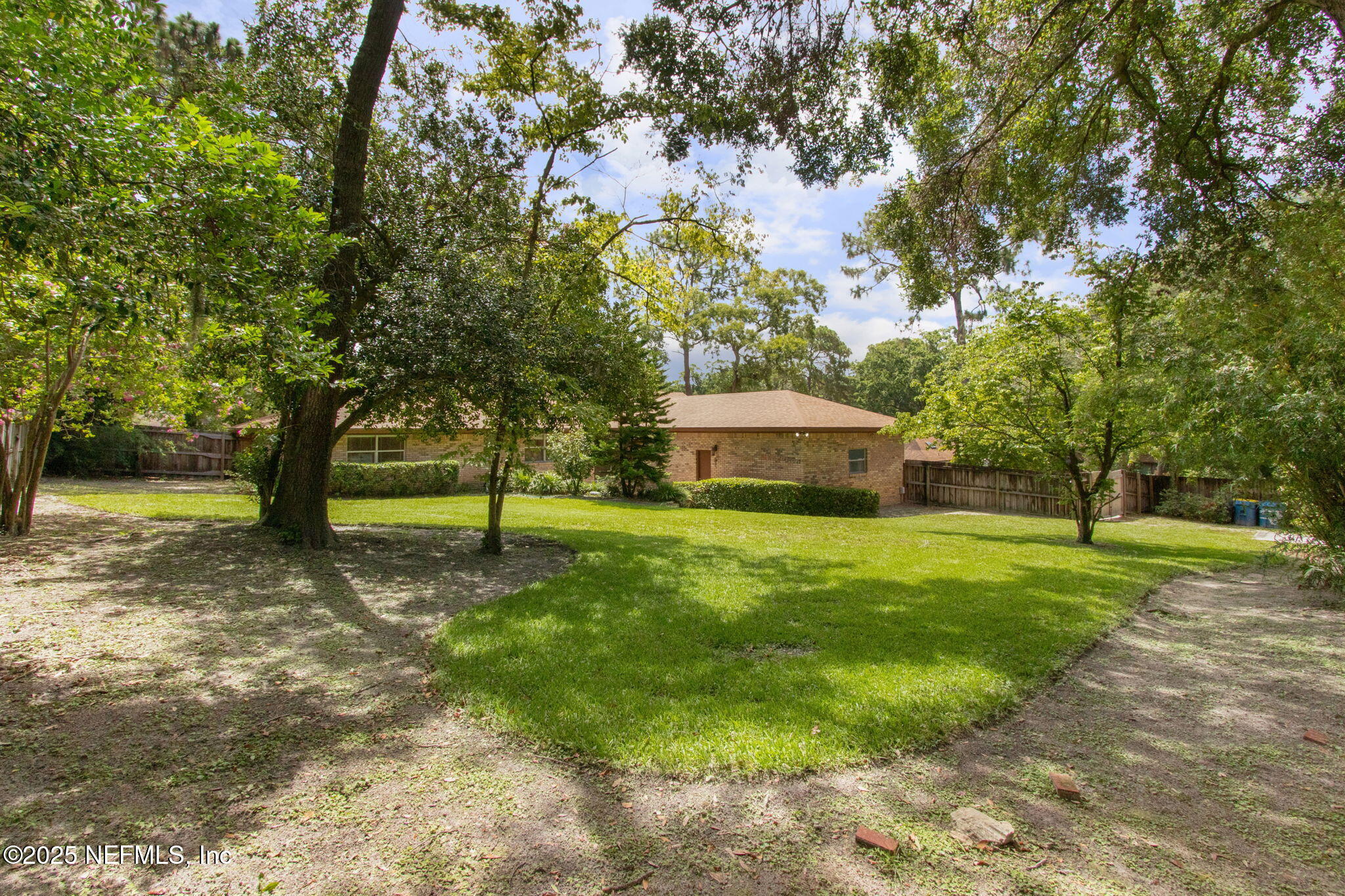 6310 WHISPERING OAKS Drive W