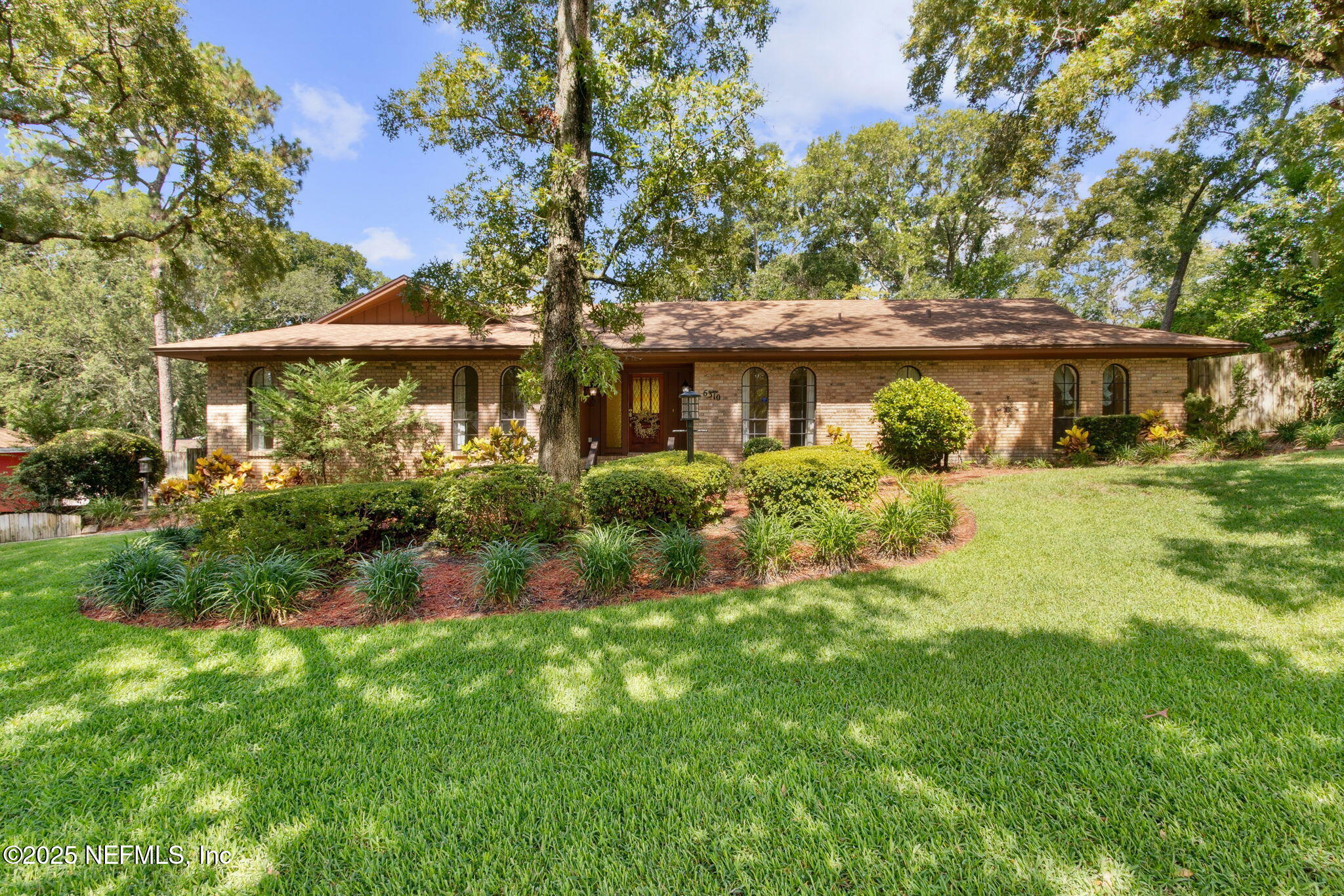 6310 WHISPERING OAKS Drive W