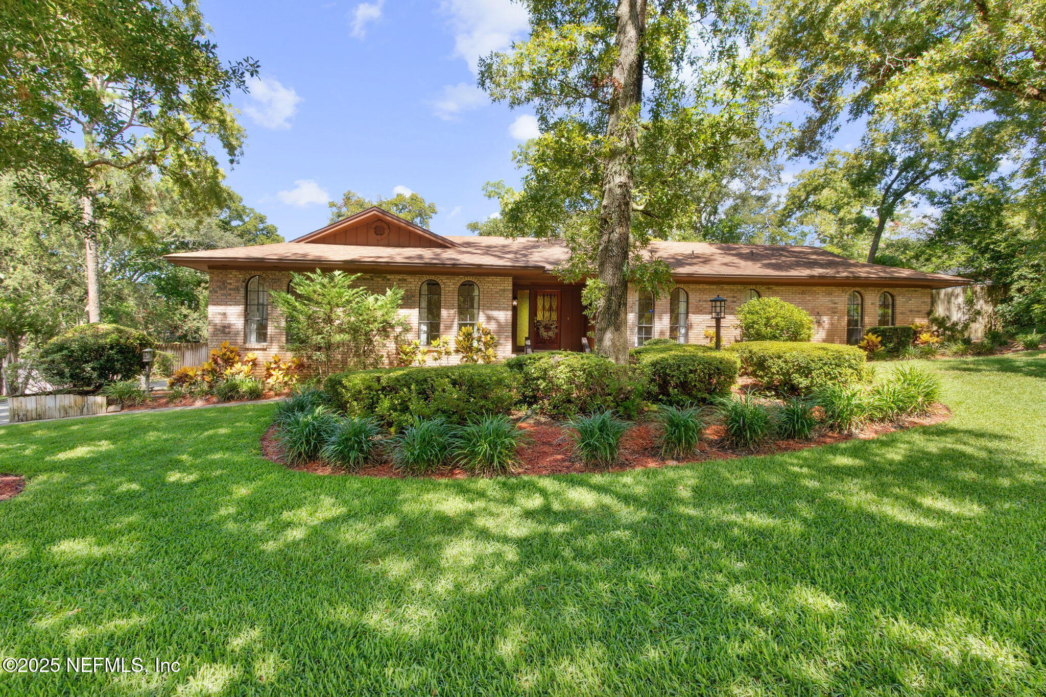6310 WHISPERING OAKS Drive W