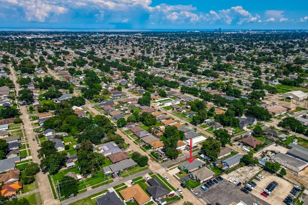 Aerial view of the neighborhood, with a red arrow marking the property on Hudson Street.