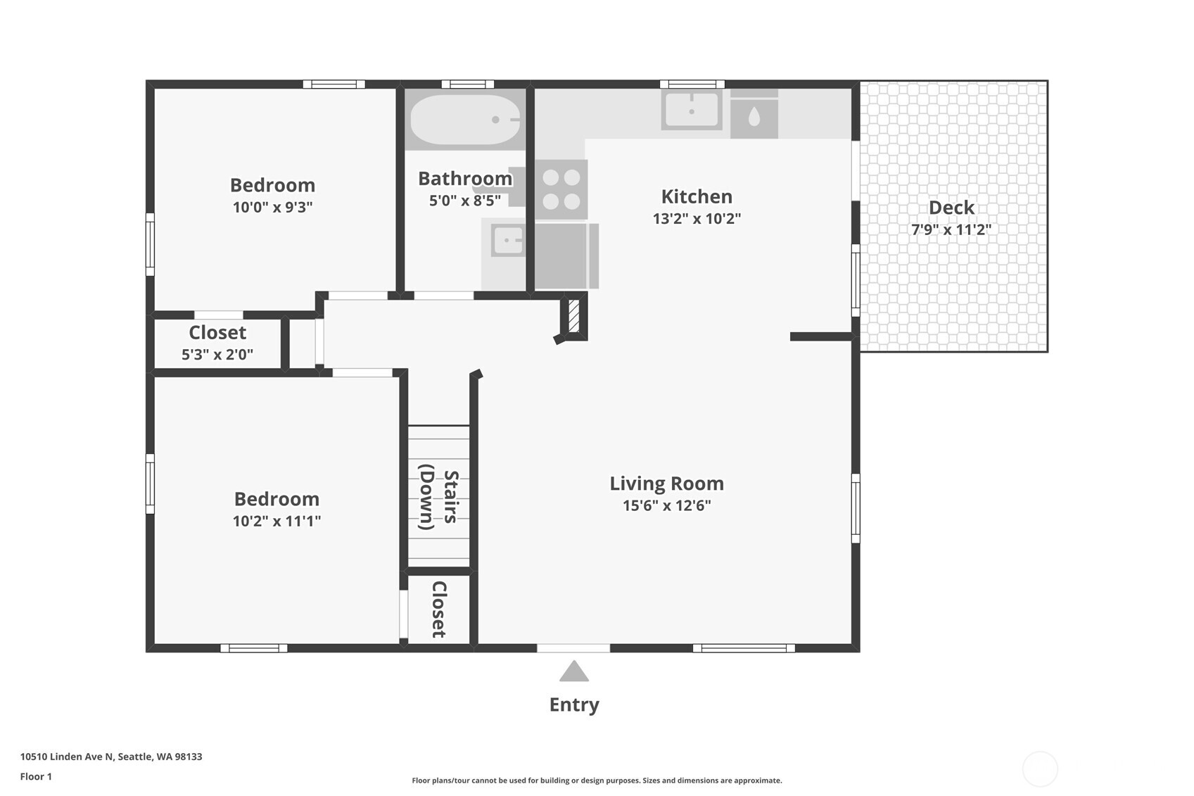 First-floor plan showing two bedrooms, a bathroom, kitchen, living room, stairs, and a deck.