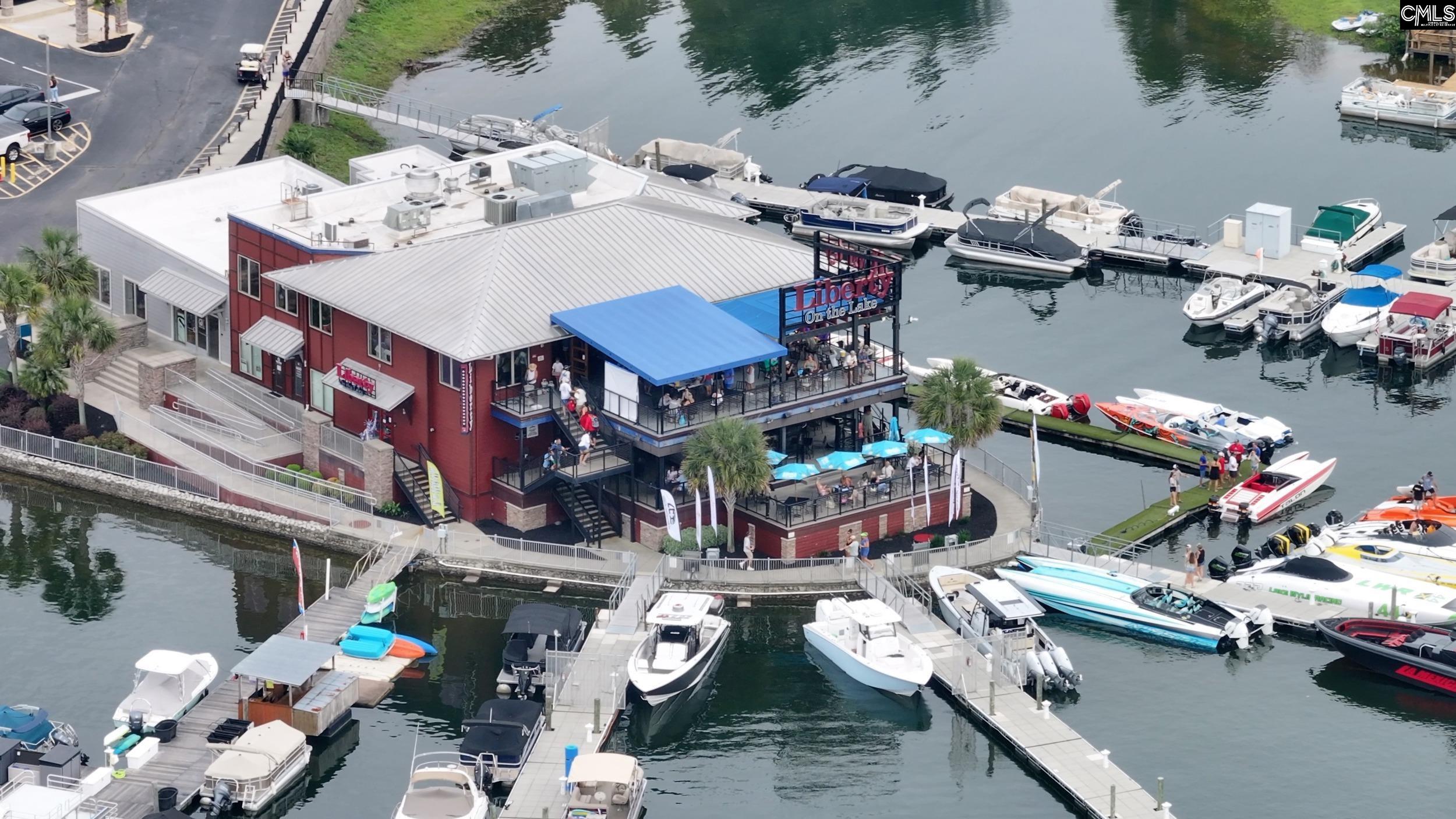 Liberty On the Lake restaurant beside a marina crowded with docked boats.