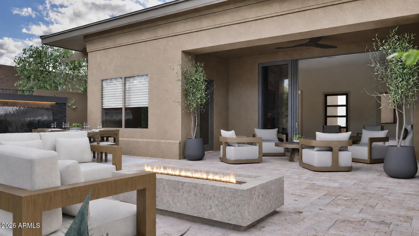 Covered patio with modern lounge seating and a long gas fire pit.