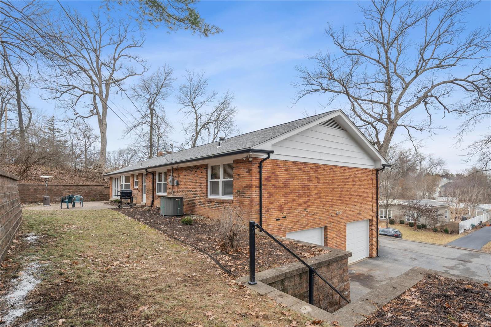 9474 Bonhomme Woods Drive