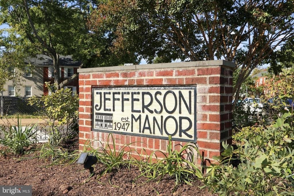 Jefferson Manor entrance sign, marked “est 1947,” set in a landscaped brick monument.