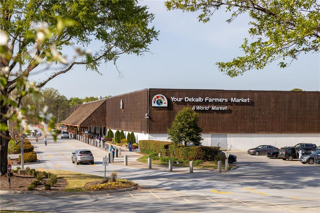 Your DeKalb Farmers Market, with its large brown facade and parking lot.