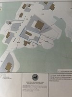 Site plan showing building footprints, parcel boundaries, and nearby roads.