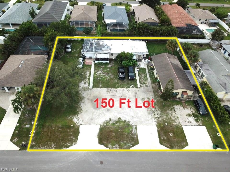 Aerial view of a 150-foot lot outlined in yellow among Naples Park homes.